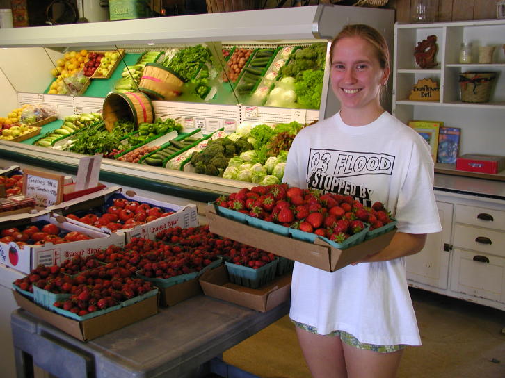 Jessica Putting More Strawberries out to Sell